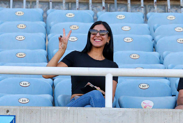 Olympiakos Nicosia Celebrates Victory Signal at GSP